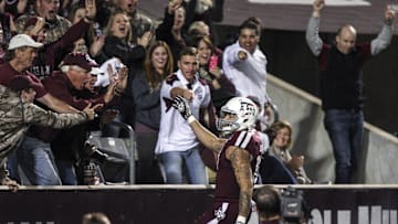Nov 2, 2013; College Station, TX, USA; Fans cheer as Texas A&M Aggies wide receiver Mike Evans (13) scores a touchdown during the third quarter against the UTEP Miners at Kyle Field. Mandatory Credit: Troy Taormina-Imagn Images
