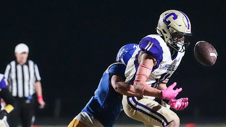 Kentucky Country Day's Piece Bahm (1) breaks up a pass intended for Campbellsville High School's Cross Watson (11) in the second half as the Bearcats defense stopped No.1 Campbellsville Friday night during KHSAA football Oct. 25, 2024. KCD won 20-18.