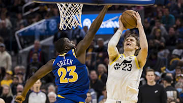 Dec 28, 2022; San Francisco, California, USA;  Golden State Warriors forward Draymond Green (23) blocks a shot by Utah Jazz forward Lauri Markkanen (23) during the second half at Chase Center. Mandatory Credit: John Hefti-Imagn Images