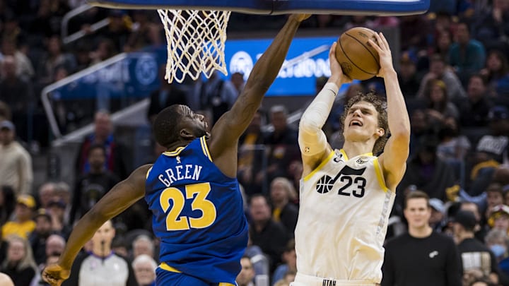 Dec 28, 2022; San Francisco, California, USA;  Golden State Warriors forward Draymond Green (23) blocks a shot by Utah Jazz forward Lauri Markkanen (23) during the second half at Chase Center. Mandatory Credit: John Hefti-Imagn Images