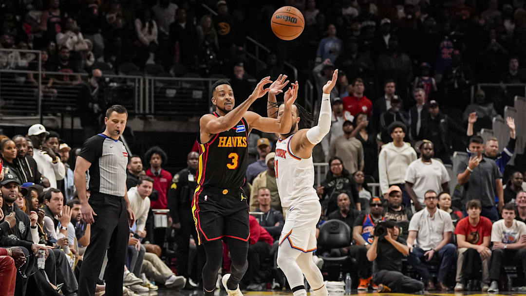 Apr 6, 2026; Atlanta, Georgia, USA; Atlanta Hawks guard CJ McCollum (3) makes a shot from beyond half court that would have tied the game but was after time expired against the New York Knicks during the second half at State Farm Arena. Mandatory Credit: Dale Zanine-Imagn Images