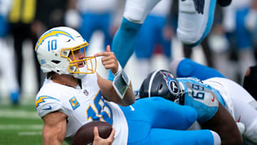 Los Angeles quarterback Justin Herbert (10) looks for a face mask call that never came after Tennessee defensive end Sebastian Joseph-Day (69) sacked him during their game at Nissan Stadium in Nashville, Tenn., Sunday, Nov. 2, 2025.