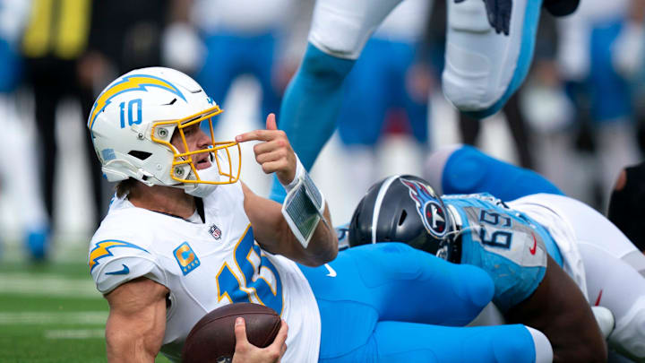 Los Angeles quarterback Justin Herbert (10) looks for a face mask call that never came after Tennessee defensive end Sebastian Joseph-Day (69) sacked him during their game at Nissan Stadium in Nashville, Tenn., Sunday, Nov. 2, 2025.