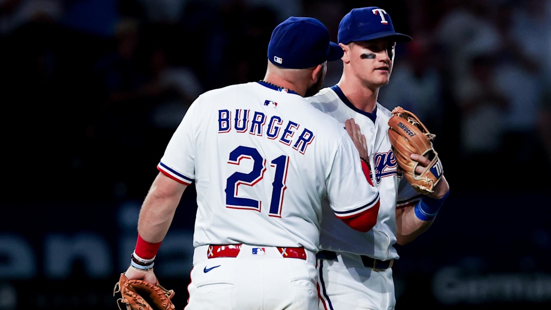 May 27, 2025; Arlington, Texas, USA; Texas Rangers first baseman Jake Burger (21) celebrates with Texas Rangers third baseman Josh Jung (6) after the game against the Toronto Blue Jays at Globe Life Field