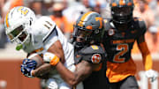 Chattanooga wide receiver Sam Phillips (11) tackled by Tennessee defensive back Jalen McMurray (6) during a game between Tennessee and Chattanooga, Saturday, Aug. 31, 2024.