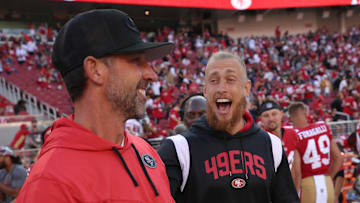 San Francisco 49ers head coach Kyle Shanahan (L) and tight end George Kittle (R)