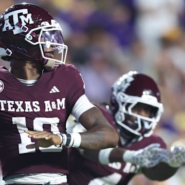 Oct 25, 2025; Baton Rouge, Louisiana, USA; Texas A&M Aggies quarterback Marcel Reed (10) drops to throw during the first half against the Louisiana State Tigers at Tiger Stadium. Mandatory Credit: Stephen Lew-Imagn Images