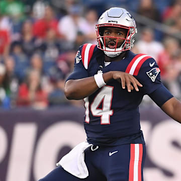 Aug 15, 2024; Foxborough, MA, USA; New England Patriots quarterback Jacoby Brissett (14) watches the ball after passing during the first half against the Philadelphia Eagles at Gillette Stadium.