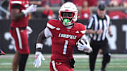 Louisville’s Isaac Brown runs the ball against Virginia at L&N Stadium Saturday.