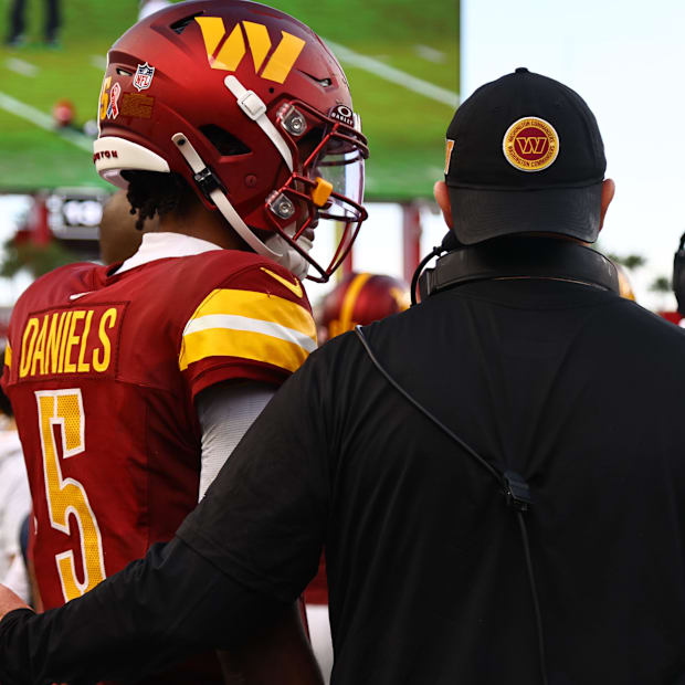 Washington Commanders quarterback Jayden Daniels and coach Dan Quinn