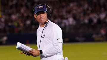 Aug 31, 2023; East Hartford, Connecticut, USA; UConn Huskies head coach Jim Mora watches from the sideline as they take on the North Carolina State Wolfpack at Rentschler Field at Pratt & Whitney Stadium. Mandatory Credit: David Butler II-Imagn Images