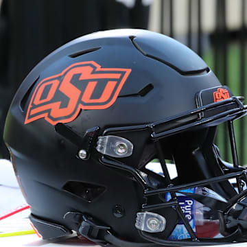 Oct 25, 2025; Lubbock, Texas, USA;  A general view of an Oklahoma State Cowboys helmet on the bench in the second half of the game against the Texas Tech Red Raiders at Jones AT&T Stadium. Mandatory Credit: Michael C. Johnson-Imagn Images