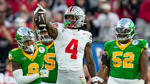 Ohio State wide receiver Jeremiah Smith (4) celebrates a first-down catch against Oregon during the 2025 Rose Bowl in Pasaden