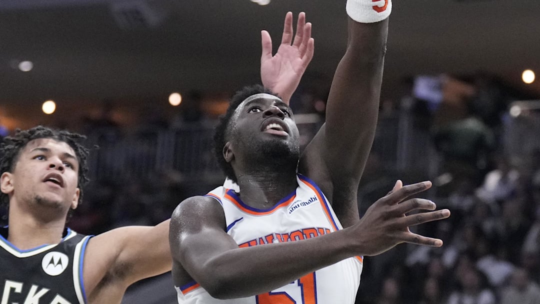 Feb 27, 2026; Milwaukee, Wisconsin, USA;  New York Knicks forward Mohamed Diawara (51) shoots against Milwaukee Bucks forward Ousmane Dieng (21) in the second half at Fiserv Forum. Mandatory Credit: Michael McLoone-Imagn Images