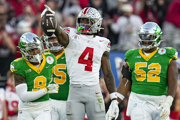 Ohio State Buckeyes wide receiver Jeremiah Smith (4) celebrates a first down catch during the second half of the College Foot