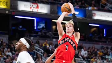 Feb 26, 2025; Indianapolis, Indiana, USA; Toronto Raptors guard Gradey Dick (1) shoots the ball while Indiana Pacers center Myles Turner (33) defends in the first half at Gainbridge Fieldhouse. Mandatory Credit: Trevor Ruszkowski-Imagn Images