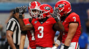 Georgia running back Nate Frazier (3) celebrates after scoring a touchdown during the second half of the NCAA Aflac Kickoff Game against Clemson in Atlanta, on Saturday, Aug. 31, 2024.