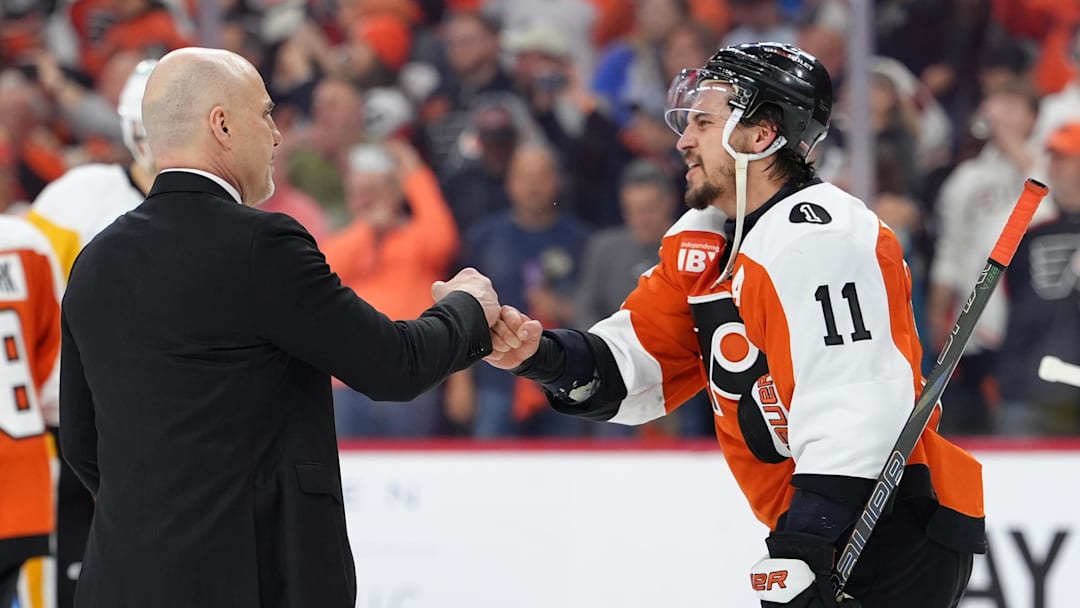 Apr 29, 2026; Philadelphia, Pennsylvania, USA; Philadelphia Flyers head coach Rick Tocchet reacts with right wing Travis Konecny (11) after game six of the first round of the 2026 Stanley Cup Playoffs against the Pittsburgh Penguins at Xfinity Mobile Arena.