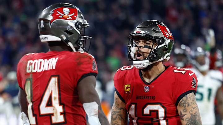 Nov 13, 2022; Munich, Germany, DEU; Tampa Bay Buccaneers wide receiver Chris Godwin (14) celebrates his touchdown with teammate wide receiver Mike Evans (13) against the Seattle Seahawks during the fourth quarter of an International Series game at Allianz Arena. Mandatory Credit: Douglas DeFelice-Imagn Images