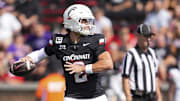 Sep 13, 2025; Cincinnati, Ohio, USA;  Cincinnati Bearcats quarterback Brendan Sorsby (2) throws a pass for a touchdown against the Northwestern State Demons in the first half at Nippert Stadium. Mandatory Credit: Aaron Doster-Imagn Images