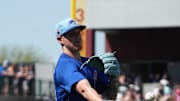 Chicago Cubs pitcher Cade Horton flips the ball for an out against the San Diego Padres in the second inning at Sloan Park on March 21.