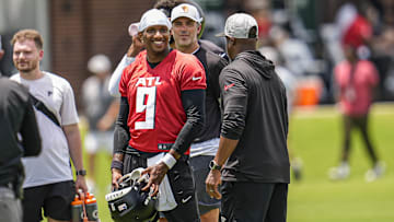 Jun 11, 2025; Atlanta, GA, USA; Atlanta Falcons quarterback Michael Penix Jr. (9) and head coach Raheem Morris on the field during Minicamp at Children's Healthcare of Atlanta Training Ground. Mandatory Credit: Dale Zanine-Imagn Images
