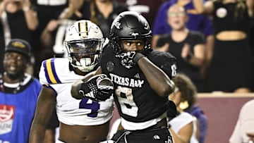 Oct 26, 2024; College Station, Texas, USA; Texas A&M Aggies running back Le'Veon Moss (8) reacts against the LSU Tigers during the third quarter. The Aggies defeated the Tigers 38-23; at Kyle Field. Mandatory Credit: Maria Lysaker-Imagn Images.