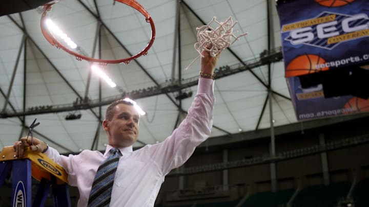 Mar 11, 2007; Atlanta, GA, USA; Florida Gators head coach Billy Donovan cuts down the net after the Gators defeated the Arkansas Razorbacks 77-56 to win the SEC Tournament championship game at the Georgia Dome in Atlanta, GA. Mandatory Credit: Jason Parkhurst-Imagn Images Copyright © 2007 Jason Parkhurst