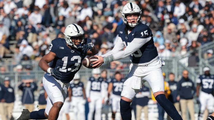 Nov 18, 2023; University Park, Pennsylvania, USA; Penn State Nittany Lions quarterback Drew Allar (15) hands off to running back Kaytron Allen (13) during the first half against the Rutgers Scarlet Knights at Beaver Stadium. Mandatory Credit: Vincent Carchietta-USA TODAY Sports