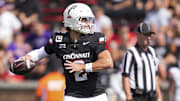 Sep 13, 2025; Cincinnati, Ohio, USA;  Cincinnati Bearcats quarterback Brendan Sorsby (2) throws a pass for a touchdown against the Northwestern State Demons in the first half at Nippert Stadium. Mandatory Credit: Aaron Doster-Imagn Images