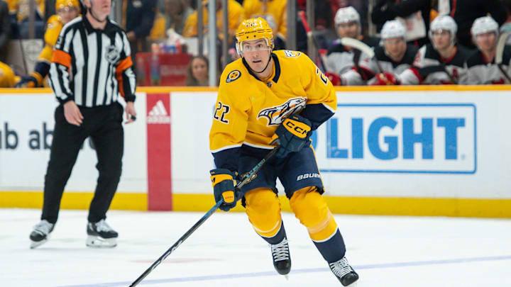 Feb 13, 2024; Nashville, Tennessee, USA;  Nashville Predators defenseman Tyson Barrie (22) skates against the New Jersey Devils during the first period at Bridgestone Arena. Mandatory Credit: Steve Roberts-Imagn Images