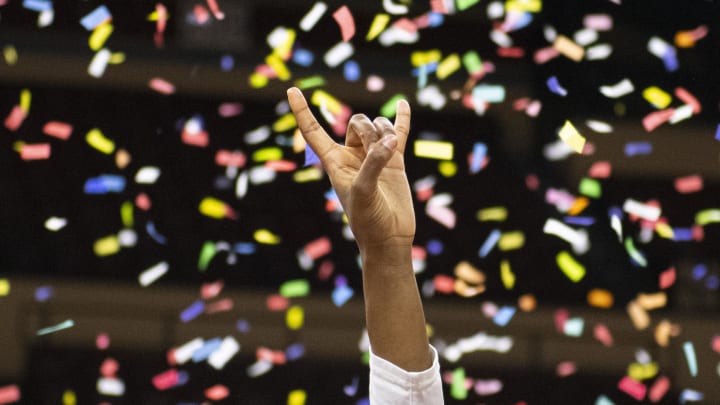 Mar 13, 2022; Kansas City, MO, USA; A Texas Longhorns player holds up the hook 'em horns.