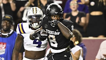Oct 26, 2024; College Station, Texas, USA; Texas A&M Aggies running back Le'Veon Moss (8) reacts against the LSU Tigers during the third quarter. The Aggies defeated the Tigers 38-23; at Kyle Field. Mandatory Credit: Maria Lysaker-Imagn Images.