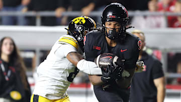 Sep 19, 2025; Piscataway, New Jersey, USA; Rutgers Scarlet Knights wide receiver Ian Strong (9) makes a catch as Iowa Hawkeyes defensive back Deshaun Lee (8) defends during the second half at SHI Stadium. Mandatory Credit: Vincent Carchietta-Imagn Images