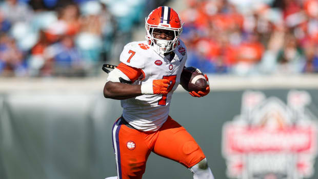 Clemson Tigers tailback Phil Mafah on a rushing attempt during a college football game in the Big Ten.
