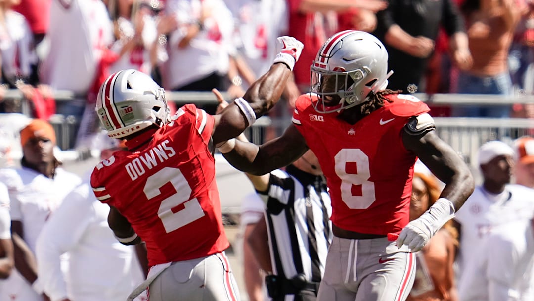 Ohio State Buckeyes safety Caleb Downs (2) and linebacker Arvell Reese (8) celebrate during the second half of the NCAA football game against the Texas Longhorns at Ohio Stadium on Aug. 30, 2025. Ohio State won 14-7.