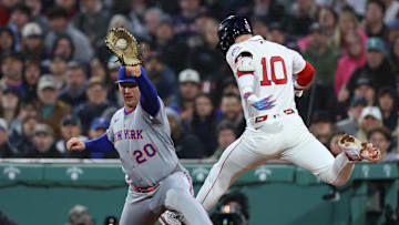 May 20, 2025; Boston, Massachusetts, USA; Boston Red Sox shortstop Trevor Story (10) tries to beat a throw to New York Mets first baseman Pete Alonso (20) during the fourth inning at Fenway Park. Mandatory Credit: Paul Rutherford-Imagn Images