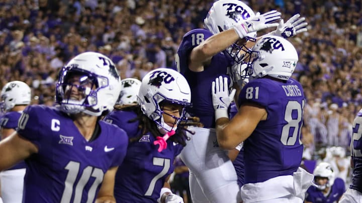 Sept. 13, 2025: TCU's Chase Curtis (81) and Ed Small celebrate a touchdown in their win over Abilene Christian.