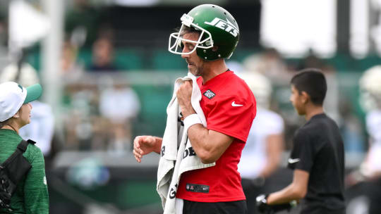 Jul 25, 2024; Florham Park, NJ, USA; New York Jets quarterback Aaron Rodgers (8) participates in a drill during training camp at Atlantic Health Jets Training Center.