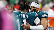 Philadelphia Eagles wide receiver A.J. Brown hugs quarterback Jalen Hurts during the second half of Super Bowl LIX