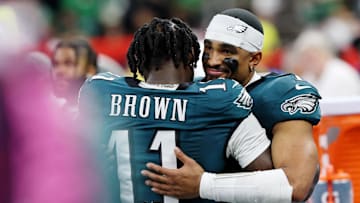 Philadelphia Eagles wide receiver A.J. Brown hugs quarterback Jalen Hurts during the second half of Super Bowl LIX
