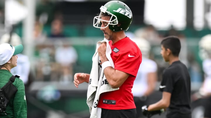 Jul 25, 2024; Florham Park, NJ, USA; New York Jets quarterback Aaron Rodgers (8) participates in a drill during training camp at Atlantic Health Jets Training Center.