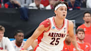 Kerr Kriisa (25) played his first three seasons of college basketball at Arizona.