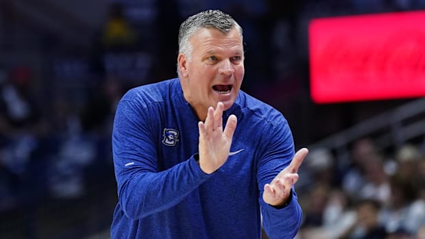 Creighton Bluejays head coach Greg McDermott watches from the sidelines they take on the UConn Huskies.
