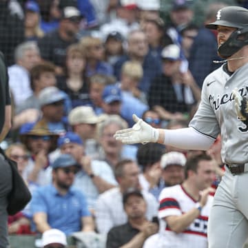 Chicago White Sox first baseman Tim Elko (30) rounds the bases after hitting a solo home run against the Chicago Cubs at Wrigley Field. 