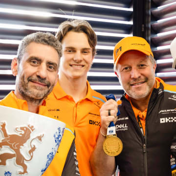 Andrea Stella, Oscar Piastri, Zak Brown, and Lando Norris