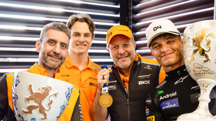 Andrea Stella, Oscar Piastri, Zak Brown, and Lando Norris