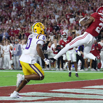 Nov 8, 2025; Tuscaloosa, Alabama, USA; Alabama Crimson Tide wide receiver Ryan Williams (2) makes a reception for a touchdown defended by Louisiana State Tigers safety Tamarcus Cooley (0) and cornerback DJ Pickett (3) during the second quarter of the game at Saban Field at Bryant-Denny Stadium. Mandatory Credit: David Leong-Imagn Images