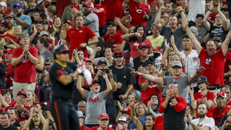 Fans cheer after a play made by Cincinnati Reds