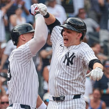 Jul 6, 2024; Bronx, New York, USA; New York Yankees first baseman Ben Rice (93) celebrates after his third home run of the game, a three run home run, with center fielder Aaron Judge (99) during the seventh inning against the Boston Red Sox at Yankee Stadium.